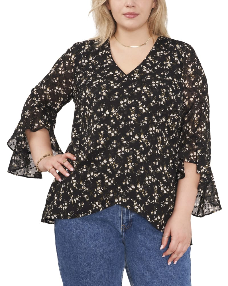 Front of a model wearing a size 1X Gabby Flutter Sleeve Blouse in RICH BLACK by Vince Camuto. | dia_product_style_image_id:261528